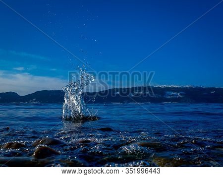 Watersplash In Thw Water By The Shore