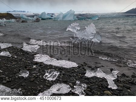 Jokulsarlon Glacial Lake, Lagoon With Ice Blocks, Iceland. Situated Near The Edge Of The Atlantic Oc