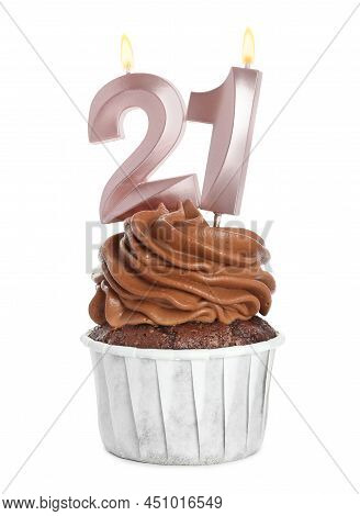 Delicious Cupcake With Number Shaped Candles On White Background. Coming Of Age Party - 21th Birthda