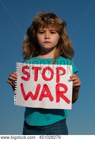 Protest Against War. Portrait Blond Little Boy Calls To Stop War, Raises Banner With Inscription Sto
