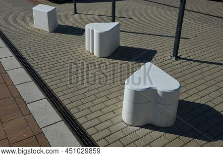 Smooth Concrete Chair-sized Castings. Suitable As An Urban Design Barrier To Enter The Pedestrian Zo