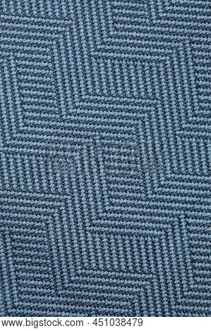 Knitted Texture. Texture Of Jacquard Fabric With Gray Blue Geometric Pattern. Crochet Mosaic Pattern