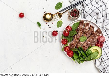 Chevapchichi Or Kofta Kebab, Bacon Wrapped Minced Meat With Spinach, Avocado And Cherry Tomato, Heal