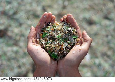 Woman Hands Holding Colored Crystals Eroded By The Sea In The Beach Of The Crystals In The Silleiro 