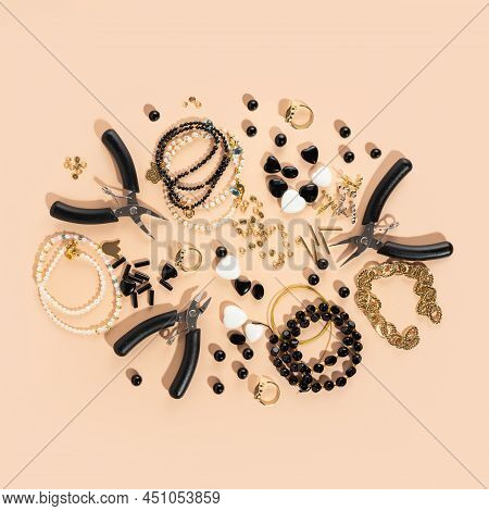 Tools And Accessories For Diy Jewelry In The Workplace. Flat Lay On Beige Background. Creative Flat