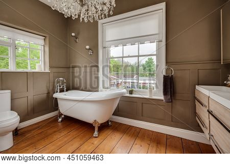 Traditional Styled Modern Bathroom With Roll Top Bath  And Half Panelled Walls Within Former Old Rec