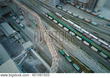 Aerial View Of Cargo Train Cars Loaded With Construction Goods At Mining Factory. Railway Transporta