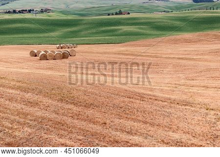 Tuscany Multi Panorama With Haystacks In Rolls In The Meadows And A Green Meadow With Fresh Grass. I
