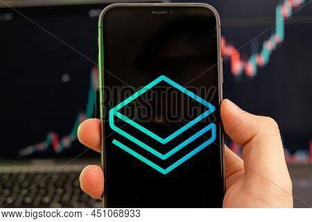 Stratis Strax Cryptocurrency Logo On The Screen Of A Smartphone In Mans Hand With A Growing Trend On
