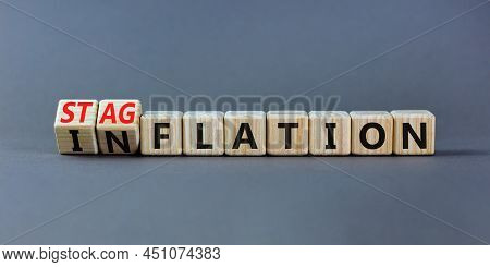Stagflation Or Inflation Symbol. Turned Wooden Cubes And Changed The Concept Word Inflation To Stagf