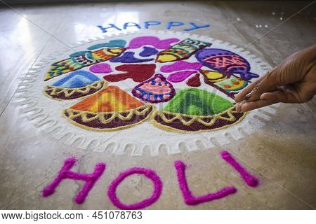 Happy Holi Wishes Backdrop. Beautiful And Colourful Happy Holi Rangoli Made At Home During Holi Fest