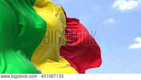 Detail Of The National Flag Of Mali Waving In The Wind On A Clear Day. Mali Is A Landlocked Country 