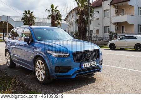 Side, Turkey - February 28 2022:  Black Volvo Xc90    Is Parked  On The Street On A Warm  Day