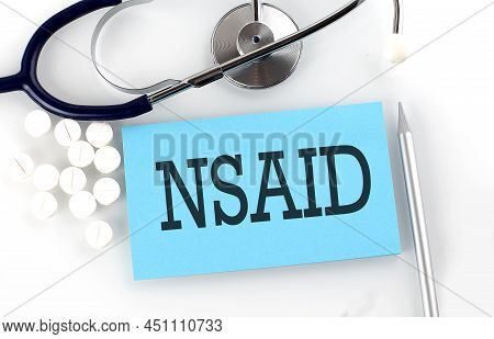 Text Nsaid On A Table With Stethoscope,pills And Pen, Medical Concept.