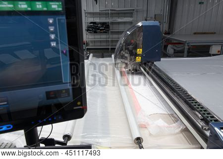 Industrial Garment Factory, A Special Laser Cutting Fabric Cuts Out Certain Textile Pieces.