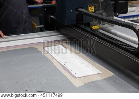 Industrial Garment Factory, A Special Laser Cutting Fabric Cuts Out Certain Textile Pieces.