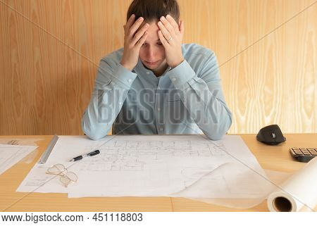 Stess, Overwork And Tired Young Architect Working On Project At Home Office