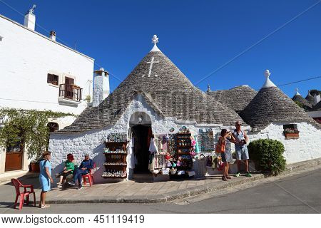Alberobello, Italy - May 29, 2017: People Visit A Souvenir Shop In Alberobello, Italy. Alberobello A