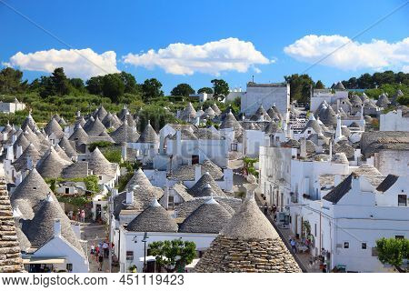 Alberobello, Italy - May 29, 2017: People Visit Alberobello, Italy. Alberobello And Its Trulli House