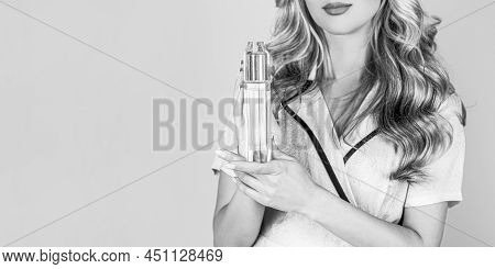 Beautiful Girl Using Perfume. Woman With Bottle Of Perfume. Woman Presents Perfumes Fragrance. Perfu