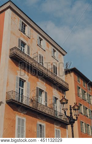 Facade Of Traditional Aged Building In The Old Town Of Nice, France, On A Sunny Day, Low Angle View 