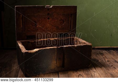 Old Wooden Box. Vintage Wooden Box. Chest Of Green Color On A Green Background. Front View.