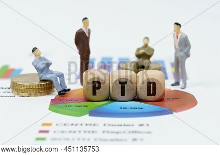 Business And Finance Concept. On Financial Reports With Diagrams, Figures Of Businessmen And Wooden 