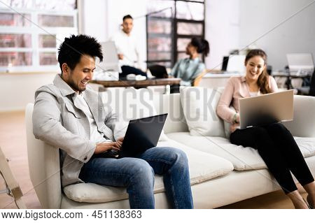Young Diverse People Working In Coliving Space
