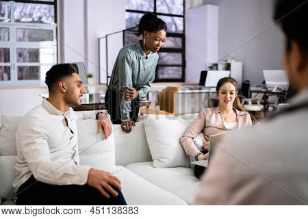 Young Diverse People Working In Coliving Space