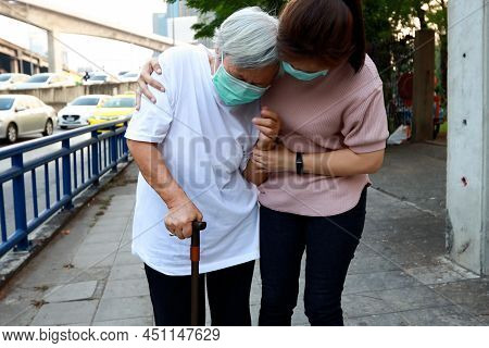 Tired Senior Woman Wearing Hygienic Mask Walk Outdoor On Street Sidewalk In City,feel Sick,vertigo,n