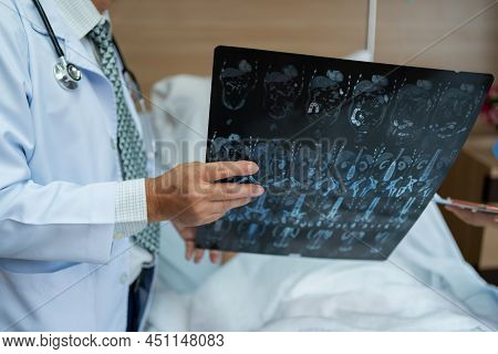 Doctor Show Film X-ray For A Patient At Hospital. Body Scan After Surgeryand Operate. Health And Wel