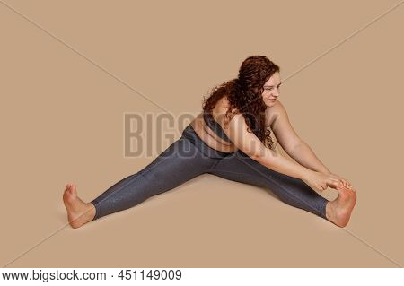 Overweight Smiling Enjoying Woman, With Obesity, Excess Fat In Gray Sportswear. Tummy, Belly Flabs I