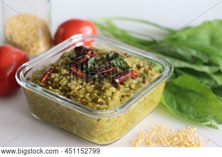 One Pot Preparation Made Of Basmati Rice, Yellow Mung Lentils, Blanched And Pureed Spinach And Spice