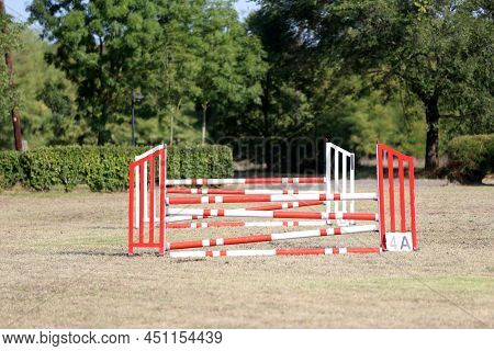 Show Jumping Poles Obstacles, Barriers, Waiting For Riders On Show Jumping Training. Horse Obstacle 