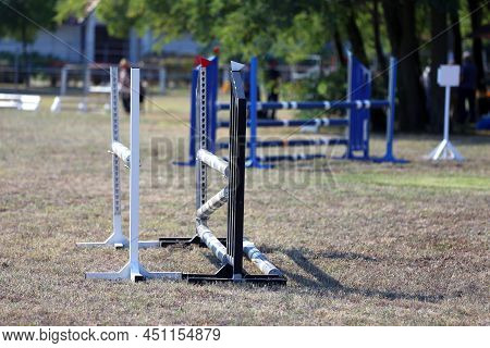Show Jumping Poles Obstacles, Barriers, Waiting For Riders On Show Jumping Training. Horse Obstacle 