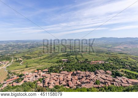 Radicofani - Italy. June 04, 2021: Ancient Tuscany Tiled Roofs village Radicofani In Italy With Long