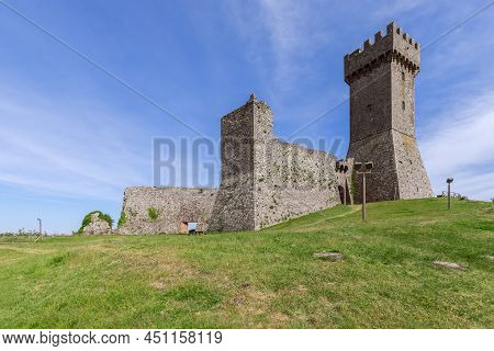 Radicofani - Italy. June 04, 2021: Daylight On Rocca Of Radicofani Fortress With Plants On Brick Wal