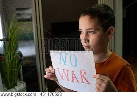 Slogan Of Peace Without War. Child With Message Stop War. A Child Against War. Antiwar, Family, Patr