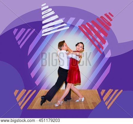 The Young Boy And Girl Posing At Dance Studio
