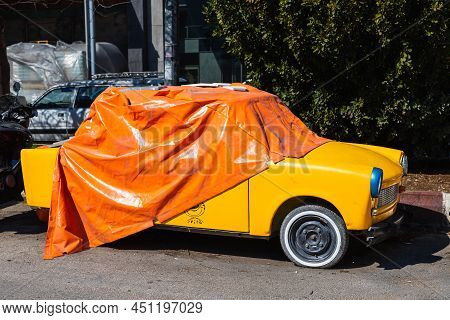 Antalya; Turkey - March 04 2022: Yelow Vintage   Trabant 601  Is Parked  On The Street On A Warm  Da