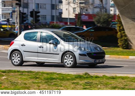 Antalya; Turkey - March 04 2022: Black Peugeot 207 Is Driving  On The Street On A Warm Summer Day
