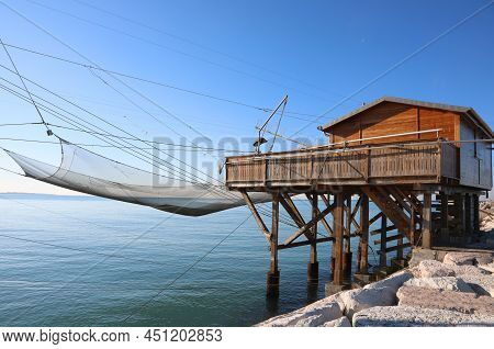 Large Fishing Hut And The Huge Nets For Catching Fish And Crustaceans In The Sea