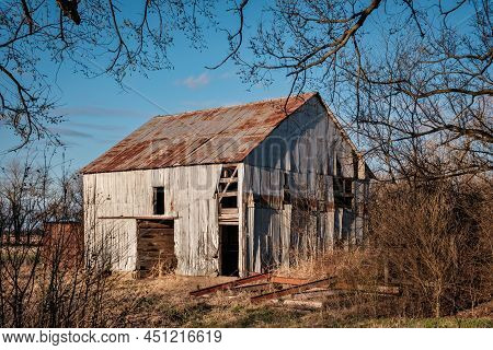 Abandonded Old Barn Falling Apart With Blue Sky Shot At Dusck