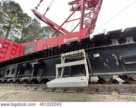 Augusta, Ga Usa - 03 19 22: Manitowoc Red Crane Construction Scene Cloudy Rainy Day Step Ladder