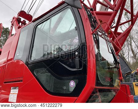 Augusta, Ga Usa - 03 19 22: Manitowoc Red Crane Construction Scene Cloudy Rainy Day Cab Side View