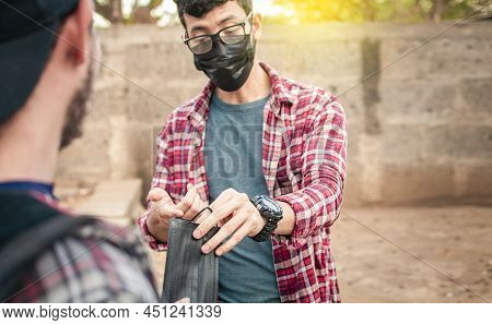 Two Young People Giving Each Other A Mask, Image Of A Young Man Giving A Mask To Another Person, Con