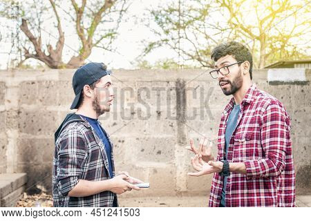 Two Young People Having A Conversation Outdoors, Two Friends Having A Conversation, Concept Of Respe