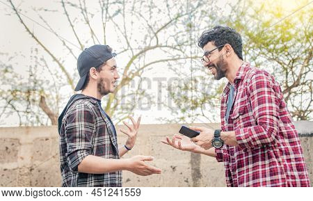 Two Young People Having A Conversation Outdoors, Two Friends Having A Conversation, Concept Of Respe