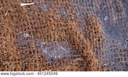 Close Up Of Water Flowing Over A Biodegradable Fibre Silt Sediment Net Trap