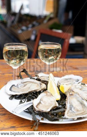 Degustation Plates With Oysters On Farmer Market In Parice, France
